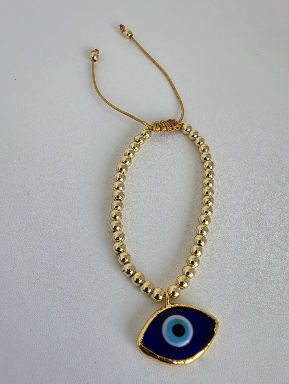 Gold Beaded Bracelet with Blue Evil Eye Charm - Women